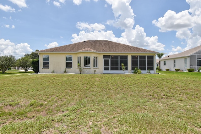 5551 NW 25th Loop, Ocala, FL 34482 - back of house with a yard, stucco siding, and a sunroom
