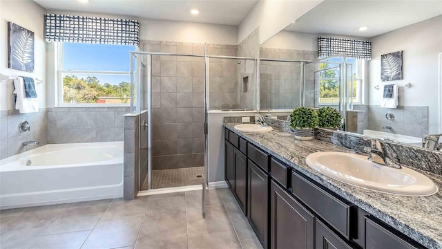 4484 SW 56th Pl, Gainesville, FL 32608 - full bath with a garden tub, double vanity, a stall shower, tile patterned floors, and recessed lighting