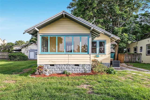 1434 SE Silver Springs Pl, Ocala, FL 34471 - bungalow featuring crawl space, a sunroom, and cooling unit