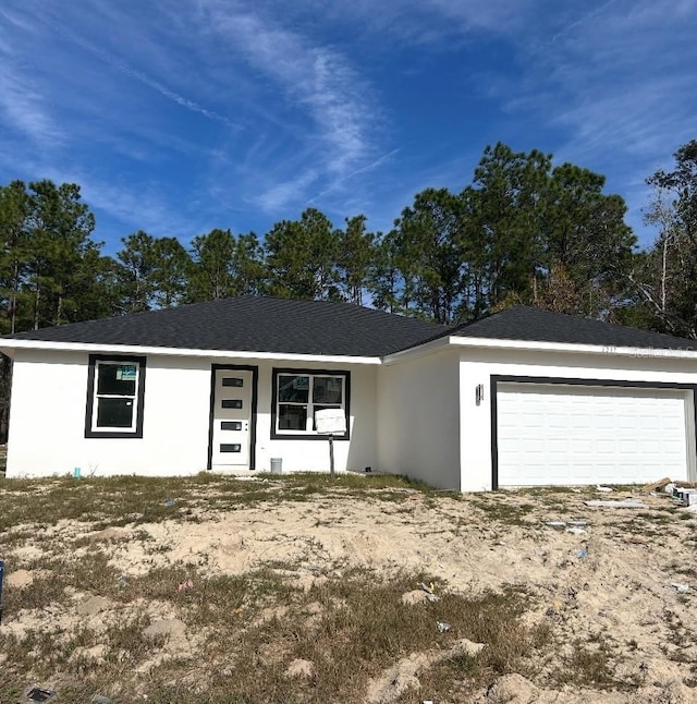 7604 SW 103rd Loop, Ocala, FL 34476 - ranch-style home with stucco siding and an attached garage