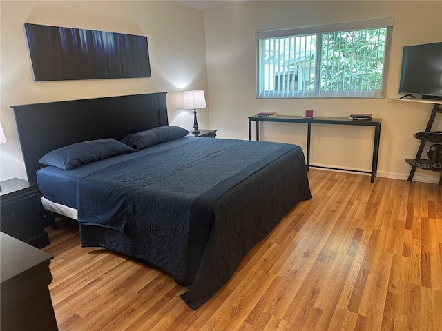 9255 SW 90th Ct Unit B, Ocala, FL 34481 - bedroom with light wood-style floors