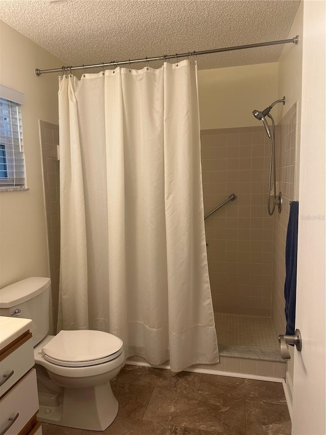 9255 SW 90th Ct Unit B, Ocala, FL 34481 - bathroom featuring a textured ceiling, toilet, vanity, and tiled shower