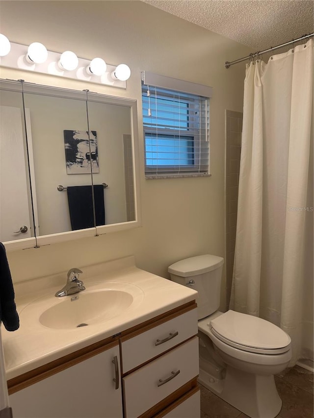 9255 SW 90th Ct Unit B, Ocala, FL 34481 - bathroom featuring toilet, vanity, a textured ceiling, and a shower with shower curtain