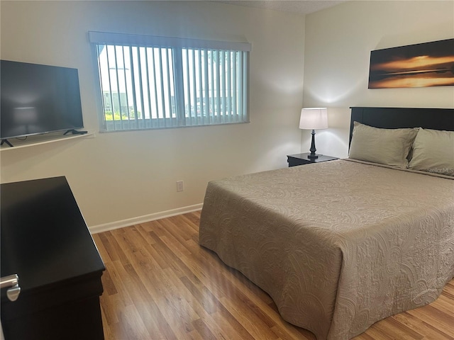 9255 SW 90th Ct Unit B, Ocala, FL 34481 - bedroom with wood finished floors and baseboards