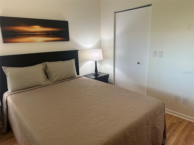 9255 SW 90th Ct Unit B, Ocala, FL 34481 - bedroom featuring light wood finished floors and baseboards