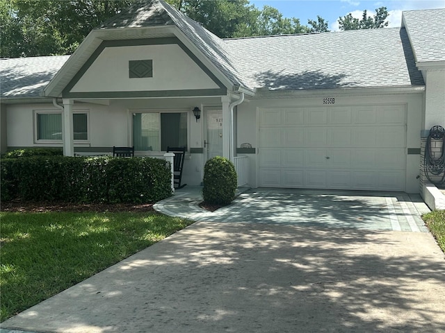 9255 SW 90th Ct Unit B, Ocala, FL 34481 - view of front of property featuring a garage, stucco siding, and driveway