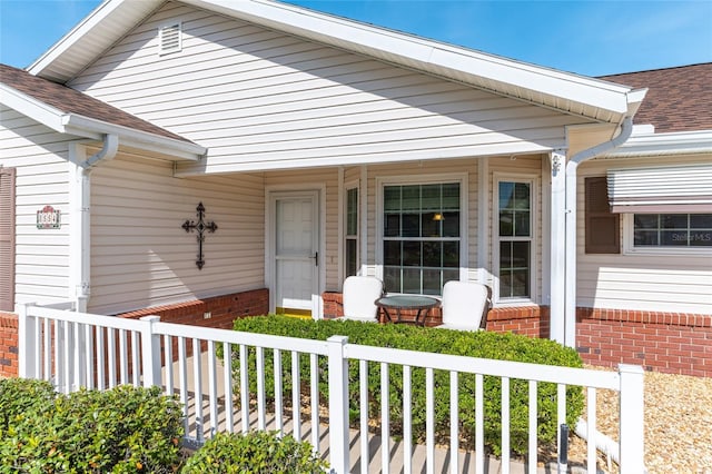 8554 SW 63rd Ct, Ocala, FL 34476 - entrance to property featuring covered porch, roof with shingles, and brick siding