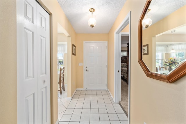8554 SW 63rd Ct, Ocala, FL 34476 - foyer entrance featuring light tile patterned floors and a textured ceiling