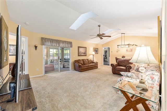 8554 SW 63rd Ct, Ocala, FL 34476 - living room with vaulted ceiling, carpet floors, a skylight, and a ceiling fan