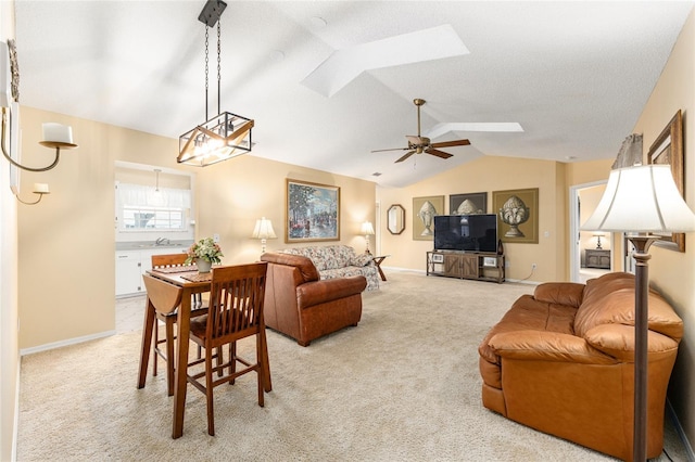 8554 SW 63rd Ct, Ocala, FL 34476 - living room with a skylight, vaulted ceiling, light carpet, and ceiling fan
