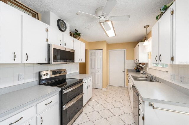 8554 SW 63rd Ct, Ocala, FL 34476 - kitchen featuring appliances with stainless steel finishes, light countertops, a ceiling fan, decorative backsplash, and a textured ceiling