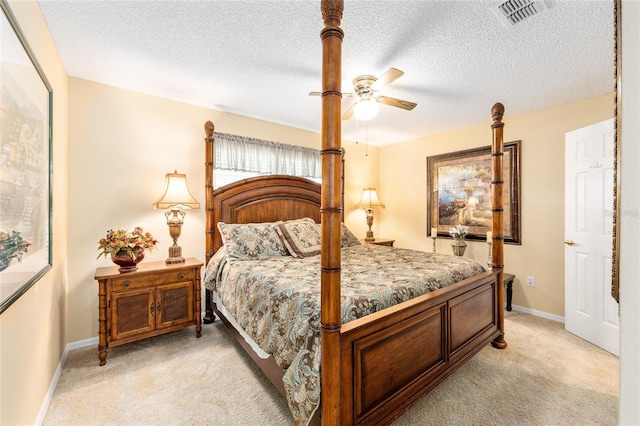 8554 SW 63rd Ct, Ocala, FL 34476 - bedroom featuring light colored carpet, a textured ceiling, and a ceiling fan
