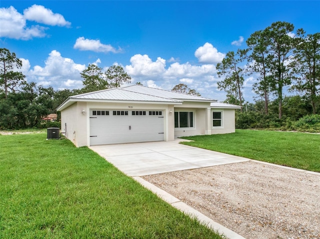 9131 Canter Path, Sebring, FL 33870 - view of front facade featuring driveway, stucco siding, a front yard, a garage, and a metal roof