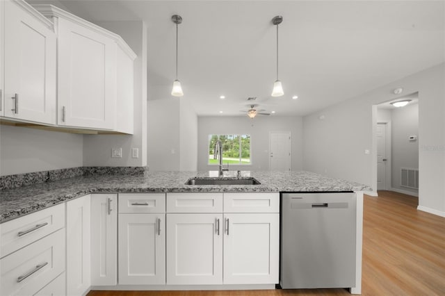 9131 Canter Path, Sebring, FL 33870 - kitchen featuring dishwasher, a peninsula, white cabinets, ceiling fan, and light stone counters
