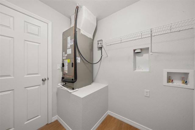 9131 Canter Path, Sebring, FL 33870 - washroom featuring washer hookup and light wood-style flooring