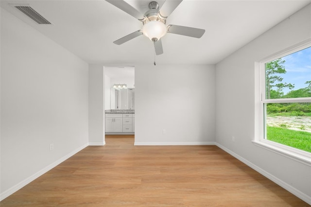 9131 Canter Path, Sebring, FL 33870 - unfurnished room featuring light wood-style flooring and a ceiling fan