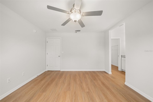 9131 Canter Path, Sebring, FL 33870 - unfurnished room featuring light wood-style flooring and a ceiling fan