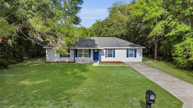 2263 Moines Ct, Dunnellon, FL 34431 - ranch-style home with driveway and a front lawn