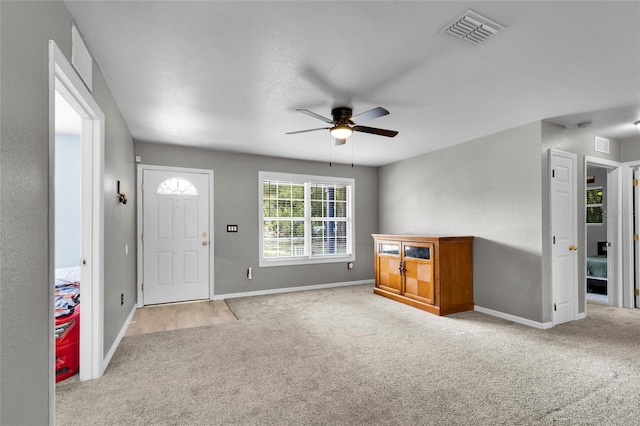 2263 Moines Ct, Dunnellon, FL 34431 - foyer entrance with carpet, ceiling fan, and baseboards