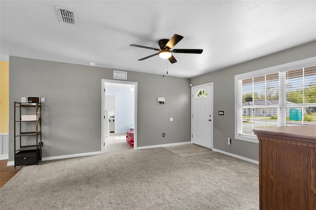 2263 Moines Ct, Dunnellon, FL 34431 - entrance foyer with a ceiling fan, baseboards, and carpet flooring