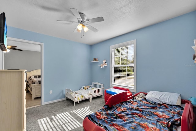 2263 Moines Ct, Dunnellon, FL 34431 - bedroom with carpet floors, ceiling fan, baseboards, and a textured ceiling