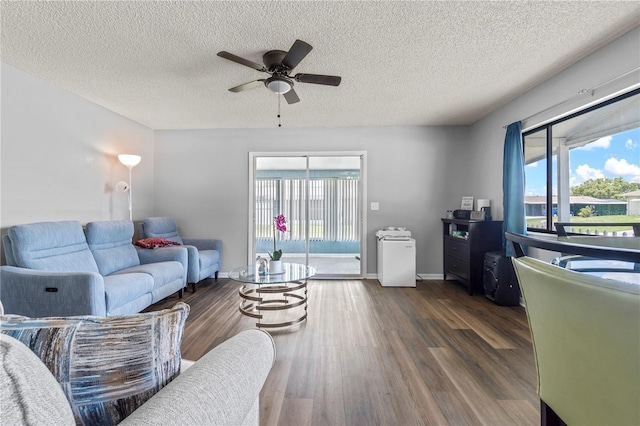 10210 SW 93rd Ave, Ocala, FL 34481 - living room featuring a textured ceiling, ceiling fan, healthy amount of natural light, and wood finished floors