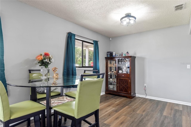 10210 SW 93rd Ave, Ocala, FL 34481 - dining space with wood finished floors and a textured ceiling