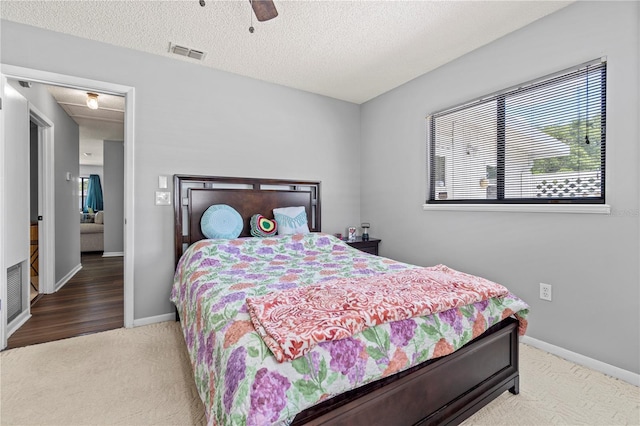 10210 SW 93rd Ave, Ocala, FL 34481 - bedroom featuring carpet flooring, ceiling fan, and a textured ceiling