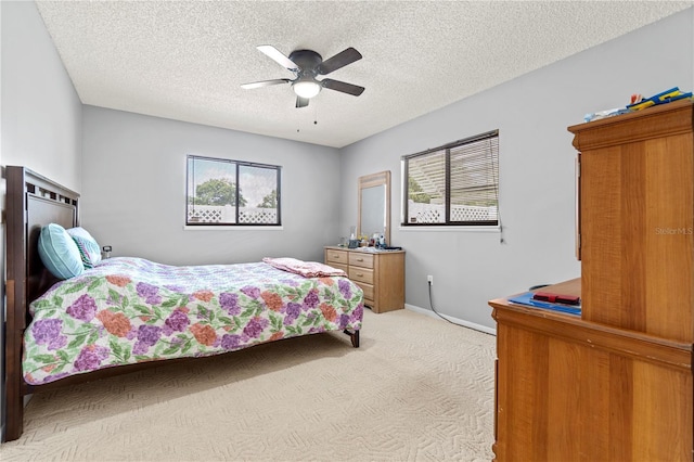 10210 SW 93rd Ave, Ocala, FL 34481 - bedroom featuring carpet floors, a textured ceiling, and a ceiling fan