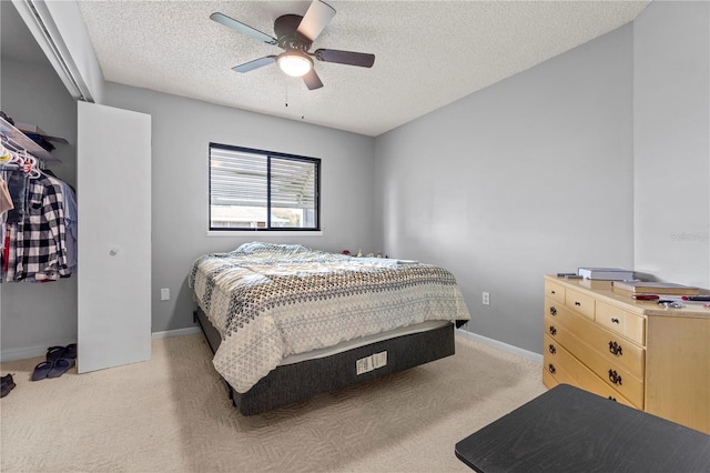 10210 SW 93rd Ave, Ocala, FL 34481 - bedroom with light colored carpet, a textured ceiling, and a ceiling fan