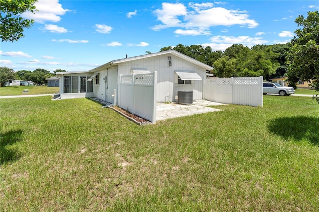10210 SW 93rd Ave, Ocala, FL 34481 - rear view of property with a sunroom