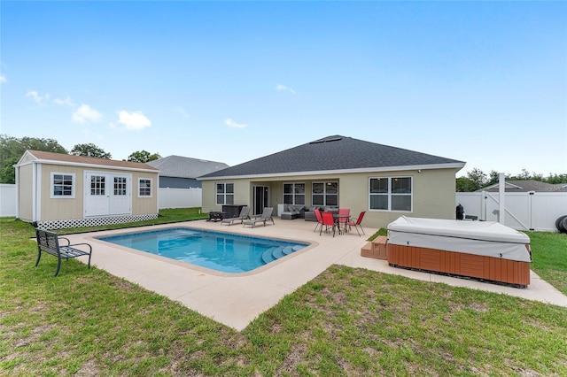 6646 SW 64th Ave, Ocala, FL 34476 - view of swimming pool with a hot tub, a fenced backyard, a patio area, and an outbuilding