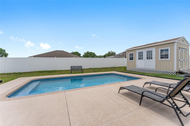 6646 SW 64th Ave, Ocala, FL 34476 - view of swimming pool with an outbuilding, a fenced backyard, and a patio area
