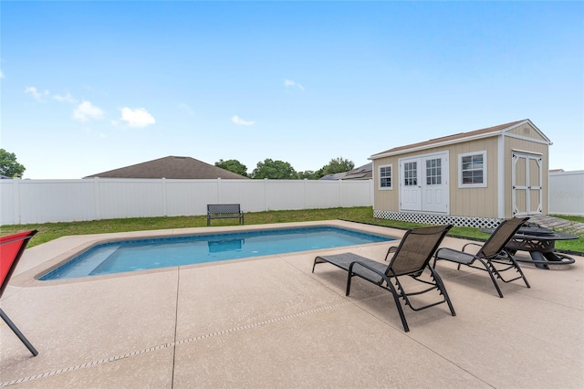6646 SW 64th Ave, Ocala, FL 34476 - view of pool featuring an outbuilding, a fenced backyard, and a patio
