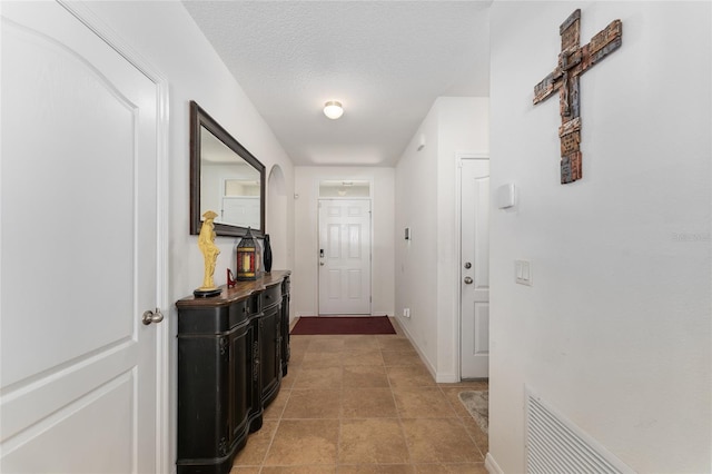 6646 SW 64th Ave, Ocala, FL 34476 - corridor with baseboards and a textured ceiling
