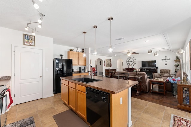 6646 SW 64th Ave, Ocala, FL 34476 - kitchen featuring black appliances, arched walkways, dark countertops, open floor plan, and an island with sink