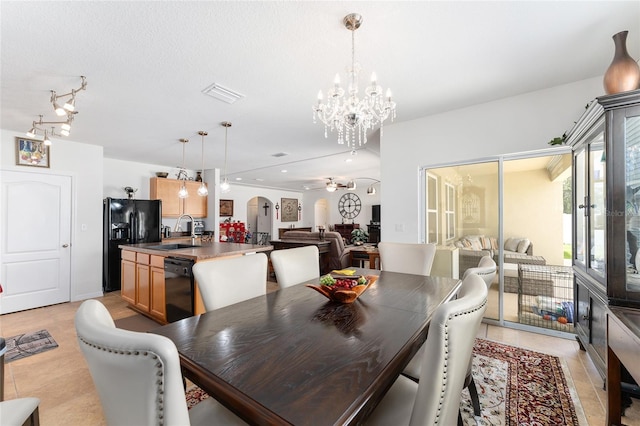 6646 SW 64th Ave, Ocala, FL 34476 - dining area with a chandelier, arched walkways, and light tile patterned floors