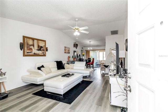 6127 SW 84th Place Rd, Ocala, FL 34476 - living area with a ceiling fan, wood finished floors, lofted ceiling, and a textured ceiling
