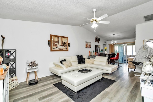 6127 SW 84th Place Rd, Ocala, FL 34476 - living area with ceiling fan, lofted ceiling, wood finished floors, a textured ceiling, and a chandelier
