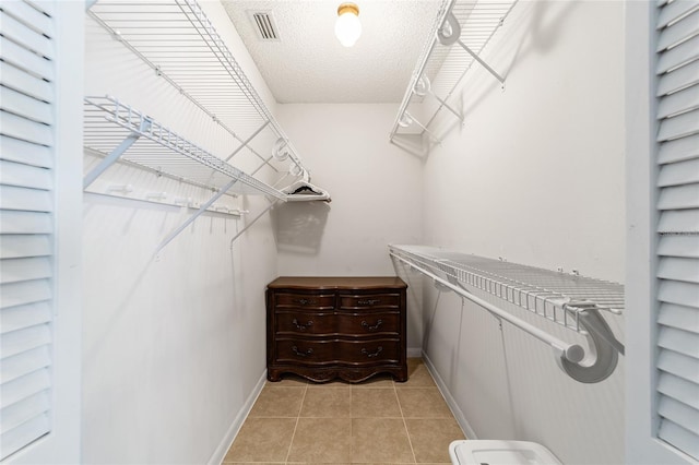 8431 SW 93rd Pl Unit F, Ocala, FL 34481 - walk in closet featuring light tile patterned flooring