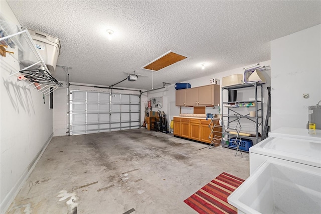 8431 SW 93rd Pl Unit F, Ocala, FL 34481 - garage with separate washer and dryer, a garage door opener, baseboards, and a sink
