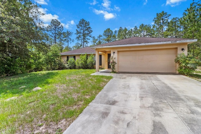23340 NW Columbine Ave, Dunnellon, FL 34431 - ranch-style home featuring stucco siding, driveway, an attached garage, and a front yard
