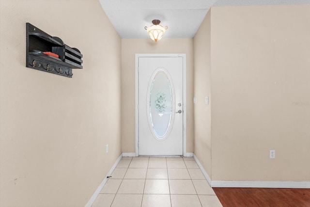 23340 NW Columbine Ave, Dunnellon, FL 34431 - doorway to outside with baseboards and light tile patterned floors