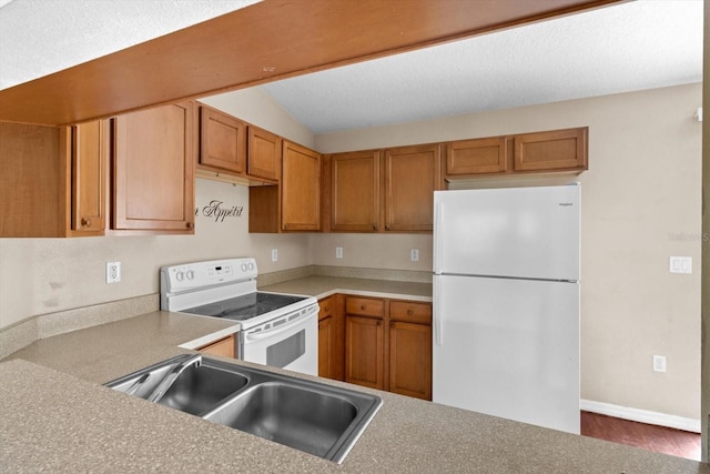 23340 NW Columbine Ave, Dunnellon, FL 34431 - kitchen featuring white appliances, a sink, vaulted ceiling, brown cabinetry, and light countertops