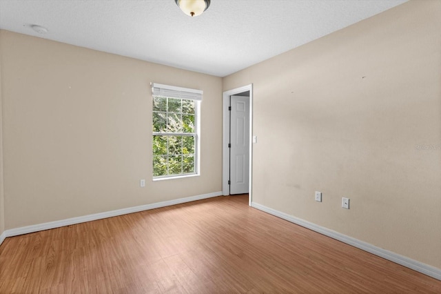 23340 NW Columbine Ave, Dunnellon, FL 34431 - empty room with wood finished floors and baseboards
