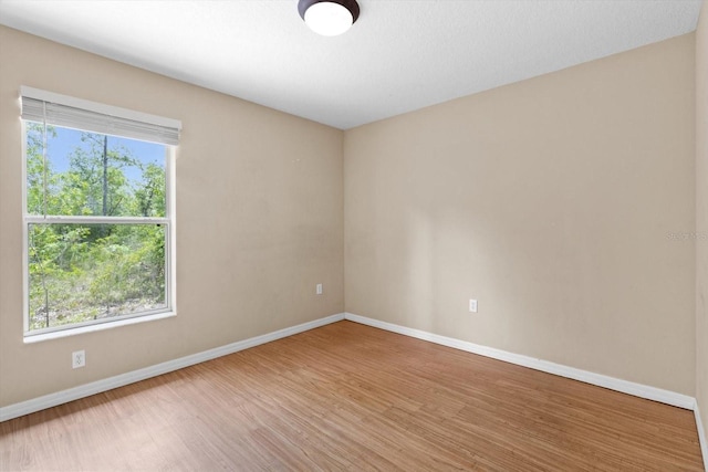 23340 NW Columbine Ave, Dunnellon, FL 34431 - spare room featuring wood finished floors and baseboards