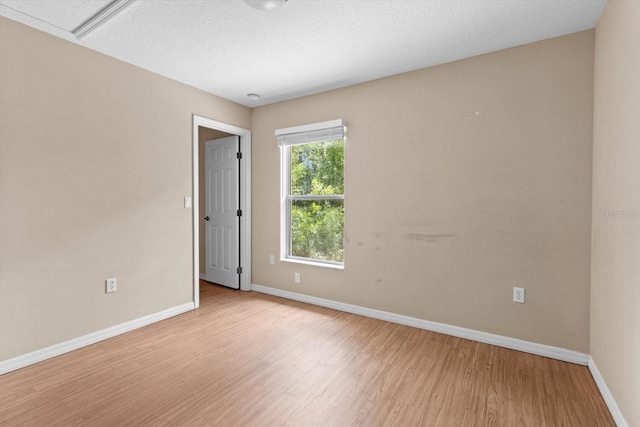 23340 NW Columbine Ave, Dunnellon, FL 34431 - spare room featuring baseboards and light wood-type flooring