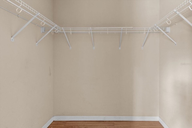 23340 NW Columbine Ave, Dunnellon, FL 34431 - walk in closet featuring wood finished floors