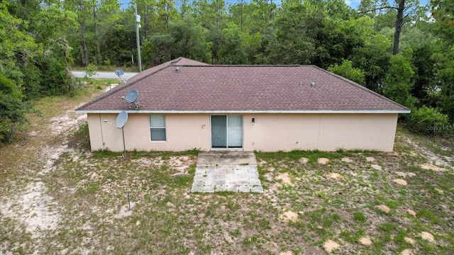 23340 NW Columbine Ave, Dunnellon, FL 34431 - rear view of property with a patio area and stucco siding