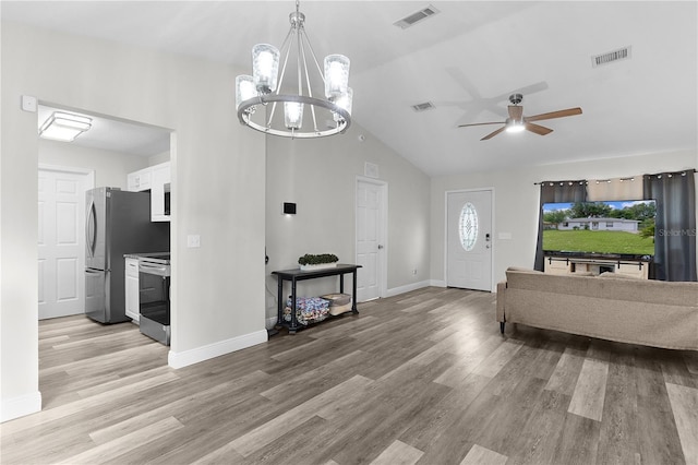 18 Banyan Pass, Ocala, FL 34472 - foyer entrance with light wood-style flooring, lofted ceiling, a ceiling fan, baseboards, and a chandelier